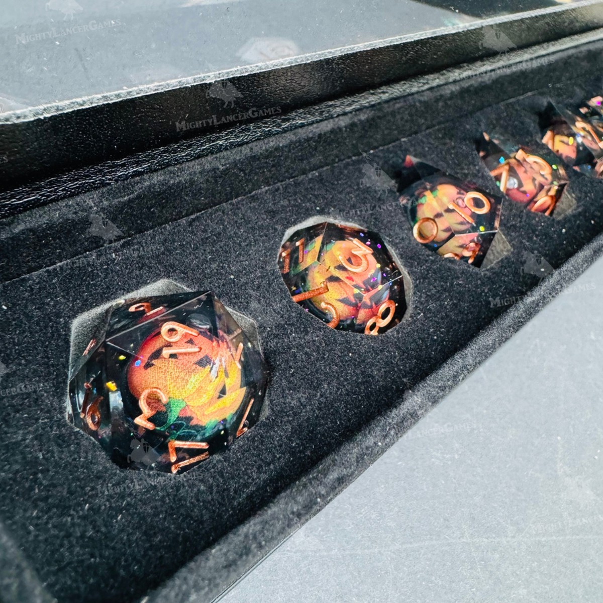 Pumpkin Liquid Core Dice in Case With Bronze Numbers
